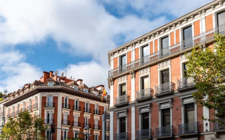 Old luxury residential buildings with balconies in Serrano Street in Salamanca district in Madrid.