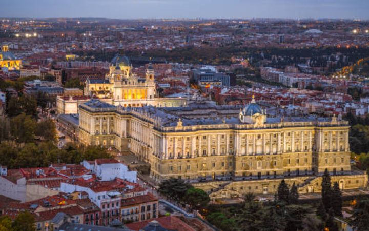 Madrid, Spain  - October 30, 2019: aerial view of  Palacio real (royal palace) and almudena cathedral at sunset